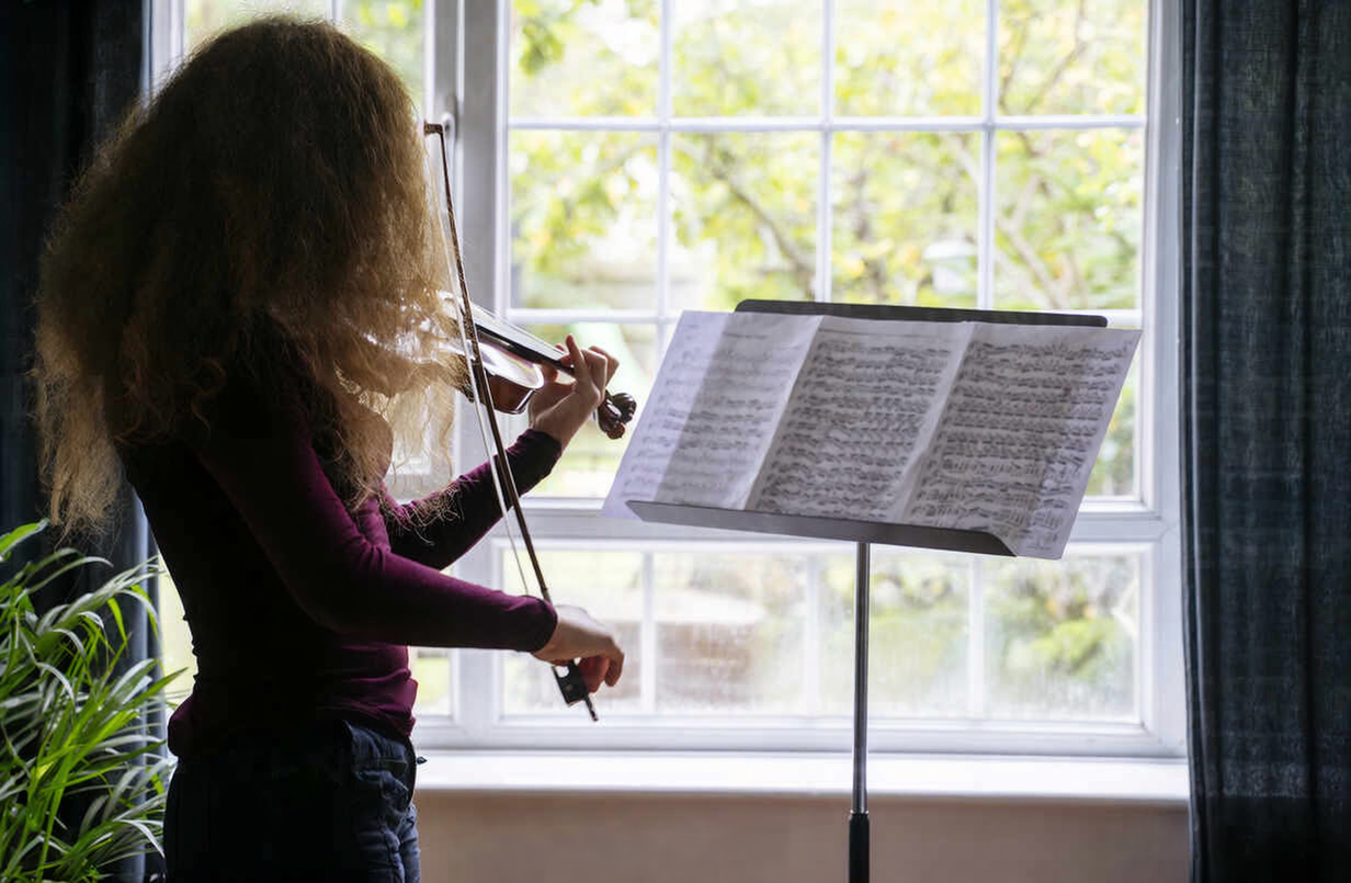 A woman playing the violin